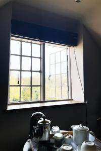 a kitchen counter with a window in a kitchen at The Ram Inn in Lewes