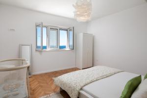 Postel nebo postele na pokoji v ubytování Blue Lagoon Beach Apartments