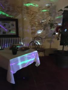 a table in a room with a table cloth on it at La Mandarine in Piolenc +143 photos