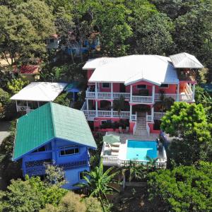 an aerial view of a house with a swimming pool at Seaside Inn Roatan in West Bay