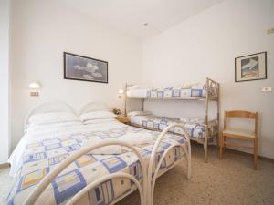 Postel nebo postele na pokoji v ubytování Hotel Gemini + 37 fotografií