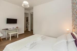 Posteľ alebo postele v izbe v ubytovaní Comfy Vatican Suite