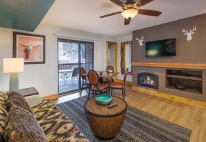 a living room with a couch and a fireplace at WorldMark Red River in Red River