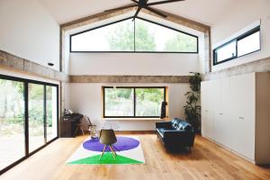 a living room with a couch and a large window at Casa Encina in Murcia