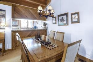 a dining room with a wooden table and chairs at Northstar Gold Bend Retreat in Truckee