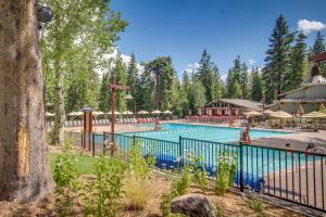a pool at a resort with people in it at Northstar Gold Bend Retreat in Truckee