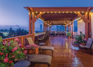 a patio with chairs and lights on a balcony at WorldMark San Diego - Balboa Park in San Diego