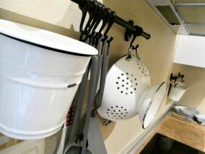 a kitchen with a sink and utensils on a wall at Logrocity Corazon de Logroño PARKING PRIVADO GRATIS in Logroño +20 photos