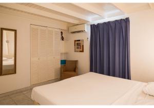Krevet ili kreveti u jedinici u okviru objekta Piscadera Bay Resort 23