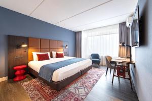 Postel nebo postele na pokoji v ubytování Hotel De Bilderberg
