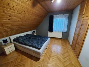 Posteľ alebo postele v izbe v ubytovaní Aranykagyló Nyaralóház