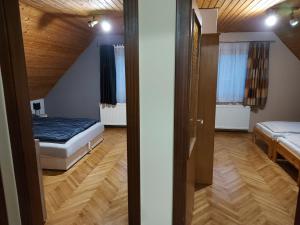 Posteľ alebo postele v izbe v ubytovaní Aranykagyló Nyaralóház