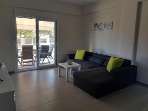 Posezení v ubytování Lagonisi Apartment