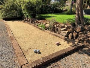 three eggs are sitting on the ground in a yard at The Bend House home in Bend