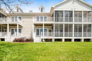 a large house with a lawn in front of it at Bear Trap Dunes - 60E October Glory in Ocean View