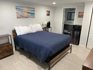 
a bedroom with a bed and a desk at The Surf Beach Motel in Amelia Island
