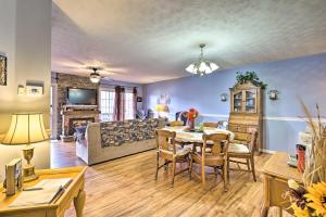 a living room with a dining table and a couch at Mountainside Retreat Stunning Watauga Lake Views! in Butler