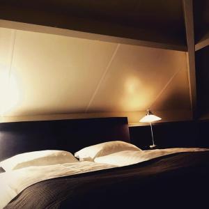 Ліжко або ліжка в номері Bed and Breakfast De Biesbosch - in 't Riet