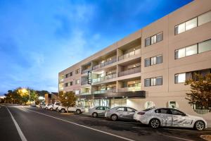 a row of cars parked in front of a building at Quest Dubbo in Dubbo