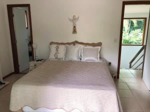 Tempat tidur dalam kamar di Casa Santa d'Ajuda