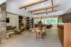 an open kitchen and dining room with a table and chairs at Sarikampos Beach in Myrtos