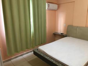 A bed or beds in a room at Hotel Goiânia