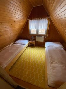 Letto o letti in una camera di Chata Jánošík