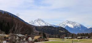 a mountain range with snow capped mountains in the distance at Haus Kehlsteinblick Hettegger in Berchtesgaden
