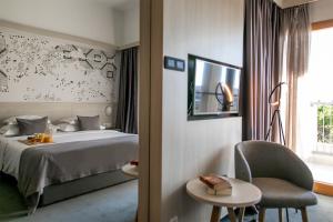 Postel nebo postele na pokoji v ubytování Hotel Salona Palace