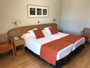 Postel nebo postele na pokoji v ubytování Hotel Tanit