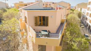 an aerial view of a house with a balcony at Valery Apartments Alghero in Alghero