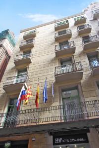 a building with flags on the side of it at Catalunya in Barcelona