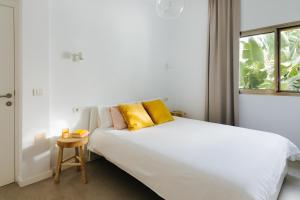 Postel nebo postele na pokoji v ubytování Punta Paradiso