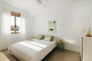 Tempat tidur dalam kamar di Punta Paradiso