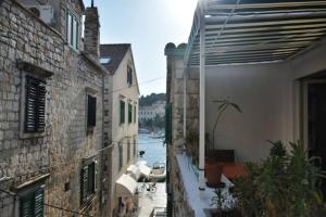 a view of a river from an alley between two buildings at The Heart of Hvar in Hvar