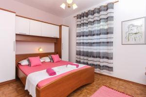 Postel nebo postele na pokoji v ubytování Apartments Lina