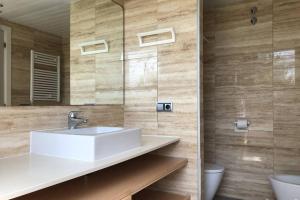 a bathroom with a sink and a mirror at NEREIDES 31 in Platja d'Aro +13 photos