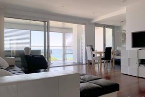 a living room with a couch and a table at NEREIDES 31 in Platja d'Aro