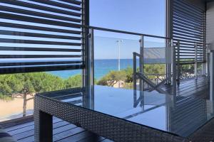 a balcony with a view of the ocean at NEREIDES 31 in Platja d'Aro
