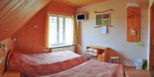 Postel nebo postele na pokoji v ubytování Guesthouse Leiputrija
