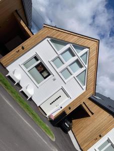 a house with a large window on the side of it at Årostunet 3 in Søgne