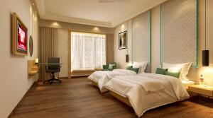 Letto o letti in una camera di Lemon Tree Premier, Bhubaneswar