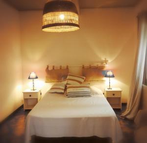 Ένα ή περισσότερα κρεβάτια σε δωμάτιο στο Villa Le Niaouli