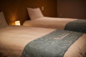 Postel nebo postele na pokoji v ubytování ADAN RESORT 灯 - Lamp -