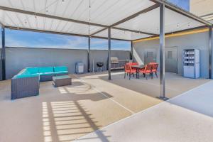 a patio with a table and chairs on a roof at La Quinta Inn & Suites by Wyndham Fort Stockton Northeast in Fort Stockton