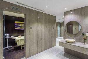 a bathroom with a sink and a mirror at Wyndham Dubai Marina in Dubai