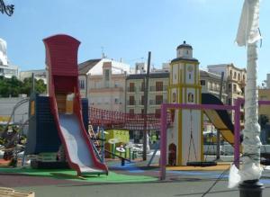 a playground with a slide and a slideintend at Piso De Balboa Wi-Fi, Air-Con in Gandía
