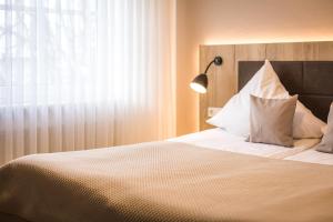 Postel nebo postele na pokoji v ubytování Hotel Lehn