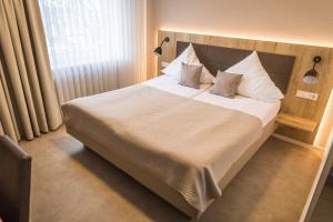 Postel nebo postele na pokoji v ubytování Hotel Lehn