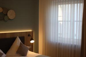 Postel nebo postele na pokoji v ubytování Hotel Lehn